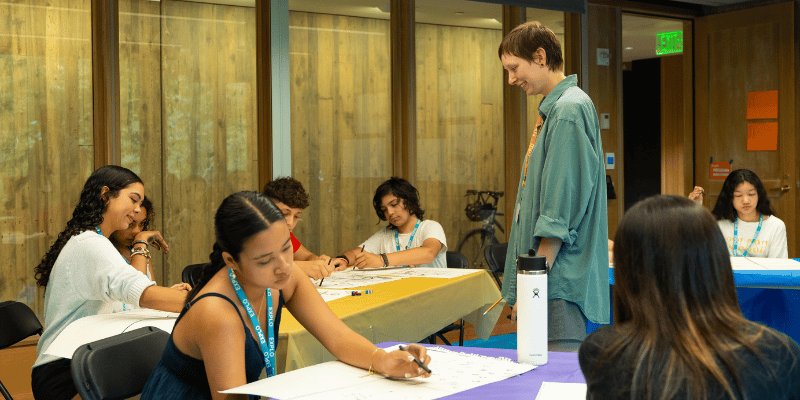 Instructor Kiara helping students