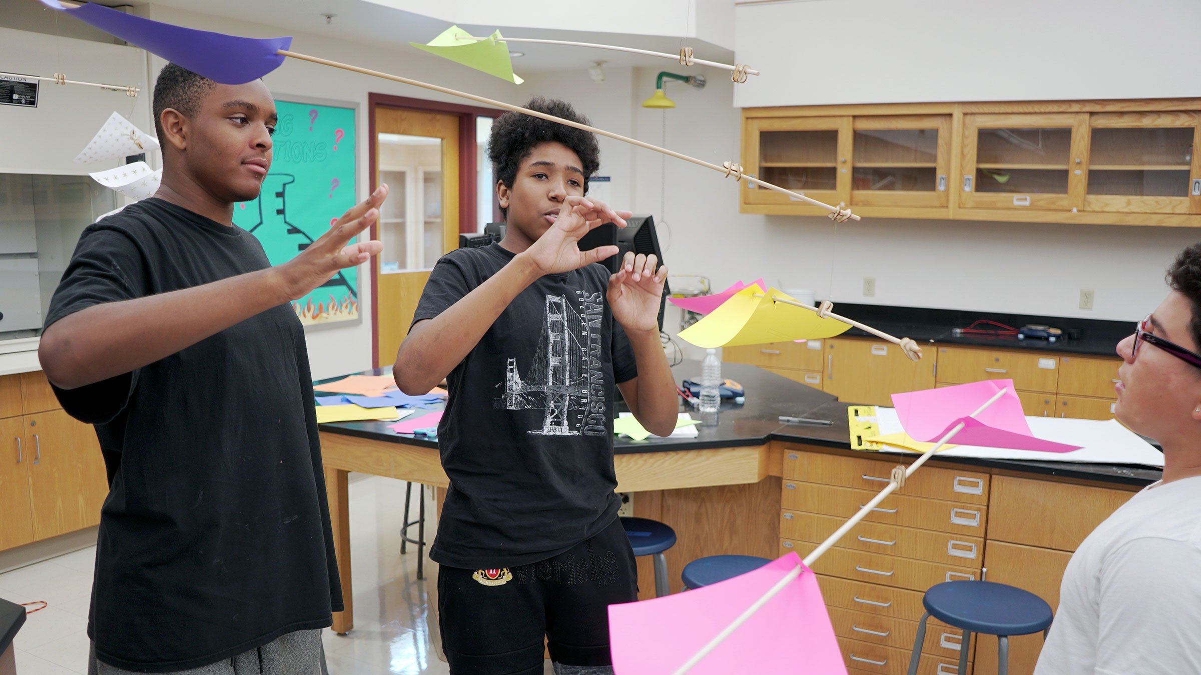SummerCollab and EXPLO partnership assist in offering underserved neighborhoods summer program.  Designing mobiles that transfer objects, students learn about balance and weight.