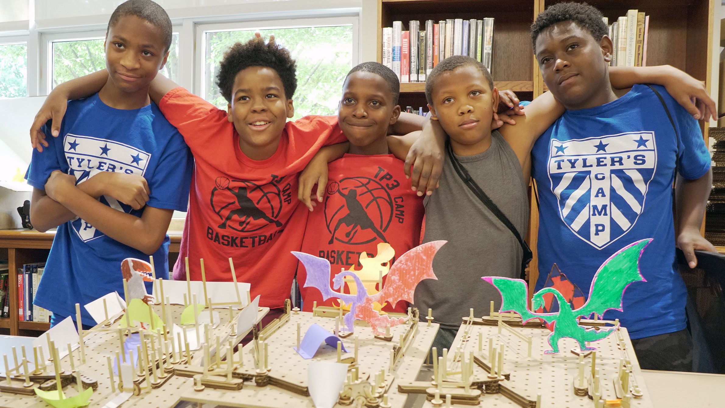 SummerCollab and EXPLO partnership assist in offering underserved neighborhoods summer program.  Students  build personal pinball machines to learn about slope and friction.