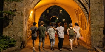 students walking together with staff to the dorms